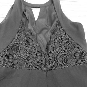 Sassy Black Romper with open lace back!